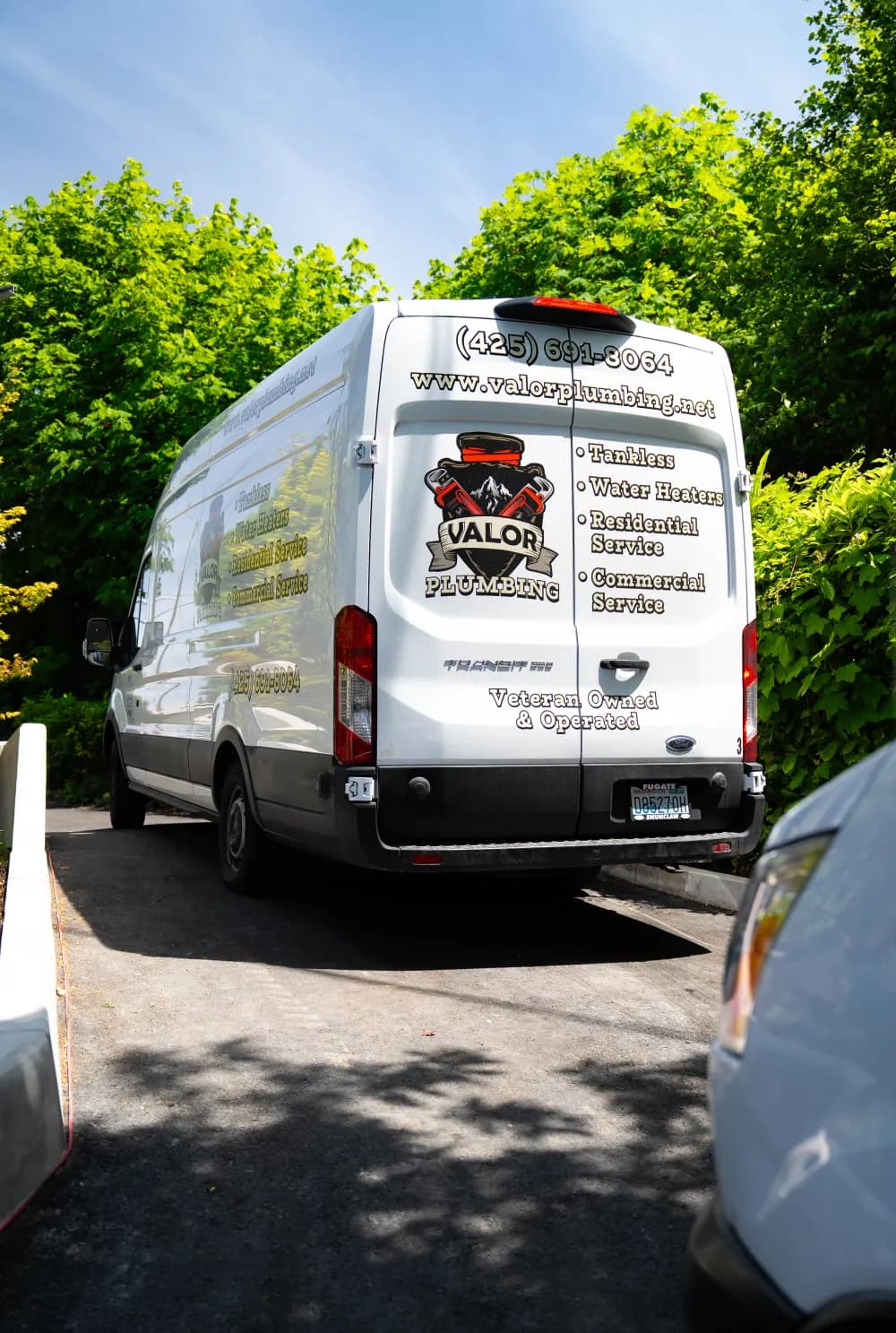 Back of the Valor Plumbing van with the Veteran Owned and Operated decal